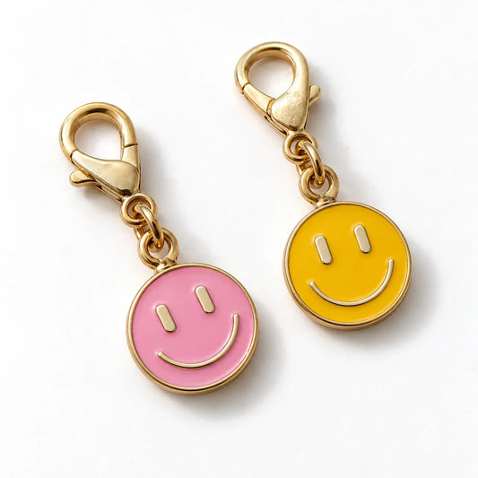 Coppia di ciondoli smile tondi smaltati con moschettone